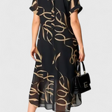 Allegra Vestido Negro con Estampado Abstracto en Oro y Escote en V