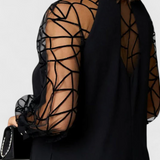 Bellezza Vestido Negro con Mangas de Malla y Corte Holgado