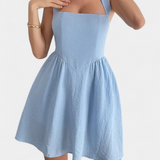 Kassandra Vestido Mini Halter con Espalda Abierta y Bolsillos
